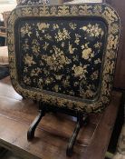 A Regency style rectangular chinoiserie gilt lacquered folding tray table, width 55cm, depth 46cm,