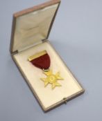 A George V 18ct gold Ranyard Nurses badge, inscribed en verso ' To Miss Irene M. Hett From The