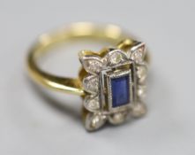 An 18ct, sapphire and diamond set rectangular cluster ring, size I, gross 4.2 grams.