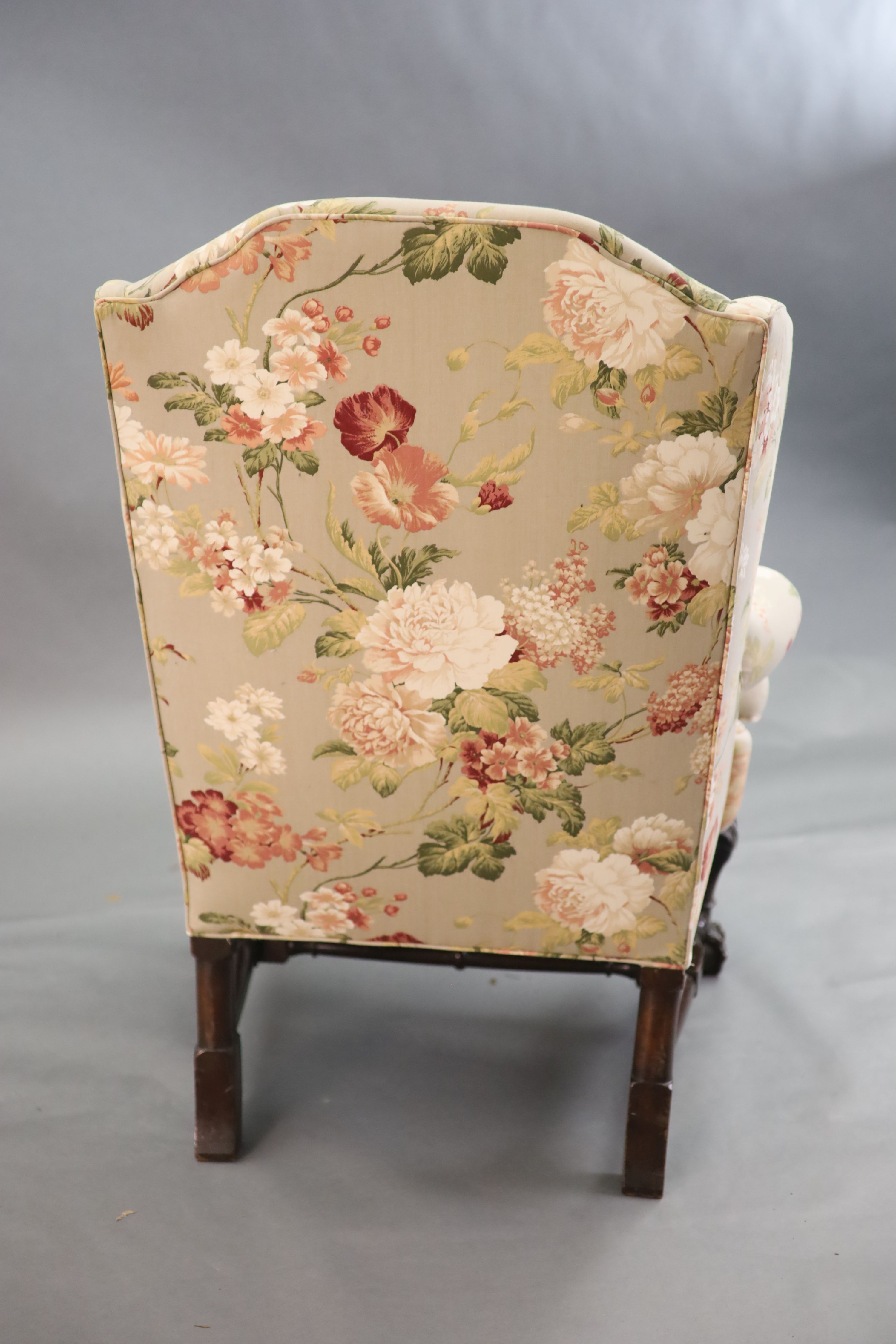 A Chippendale revival wing armchair together with a matching contemporary footstoolCONDITION: Late - Image 5 of 9
