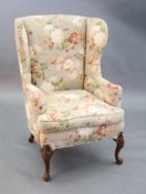 A French Hepplewhite style wing armchair together with a matching contemporary footstool