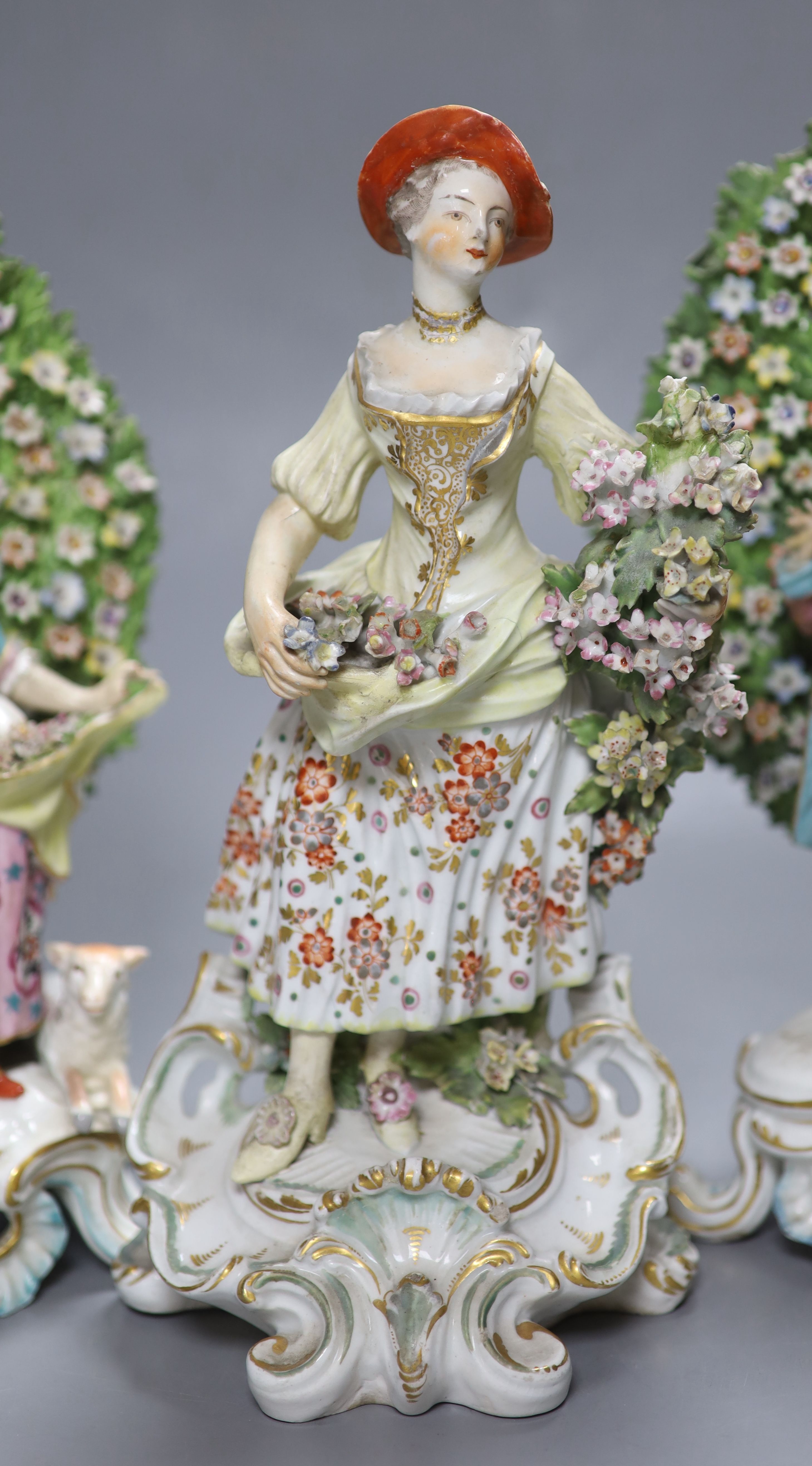 An 18th century Derby figure of a flower seller and a pair of French porcelain bocage groups, - Image 4 of 4