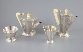 A stylish 1930's Art Deco silver four piece tea and coffee service by Charles Boyton, of conical