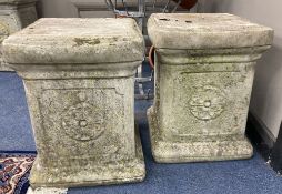 A pair of reconstituted stone plinths, height 39cm