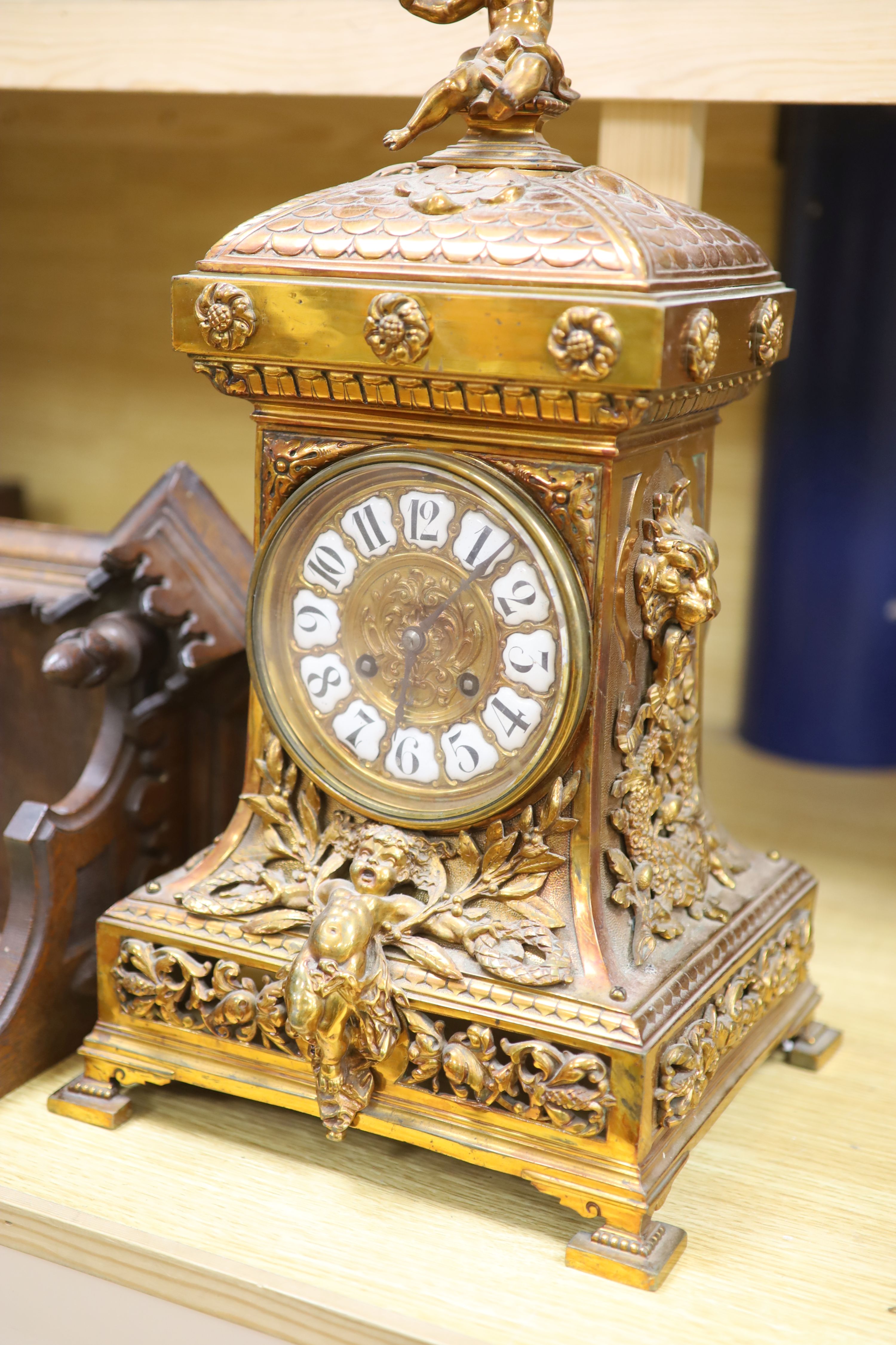 A late 19th century French cast brass cased eight day mantel clock and a carved oak clock bracket, - Image 2 of 5