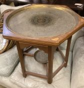 An Indian hexagonal brass tray top occasional table, width 60cm, depth 70cm, height 55cm together