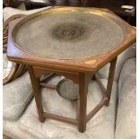 An Indian hexagonal brass tray top occasional table, width 60cm, depth 70cm, height 55cm together