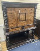 An early 19th century Dutch ebonised parquetry inlaid walnut cabinet on stand, width 136cm, depth