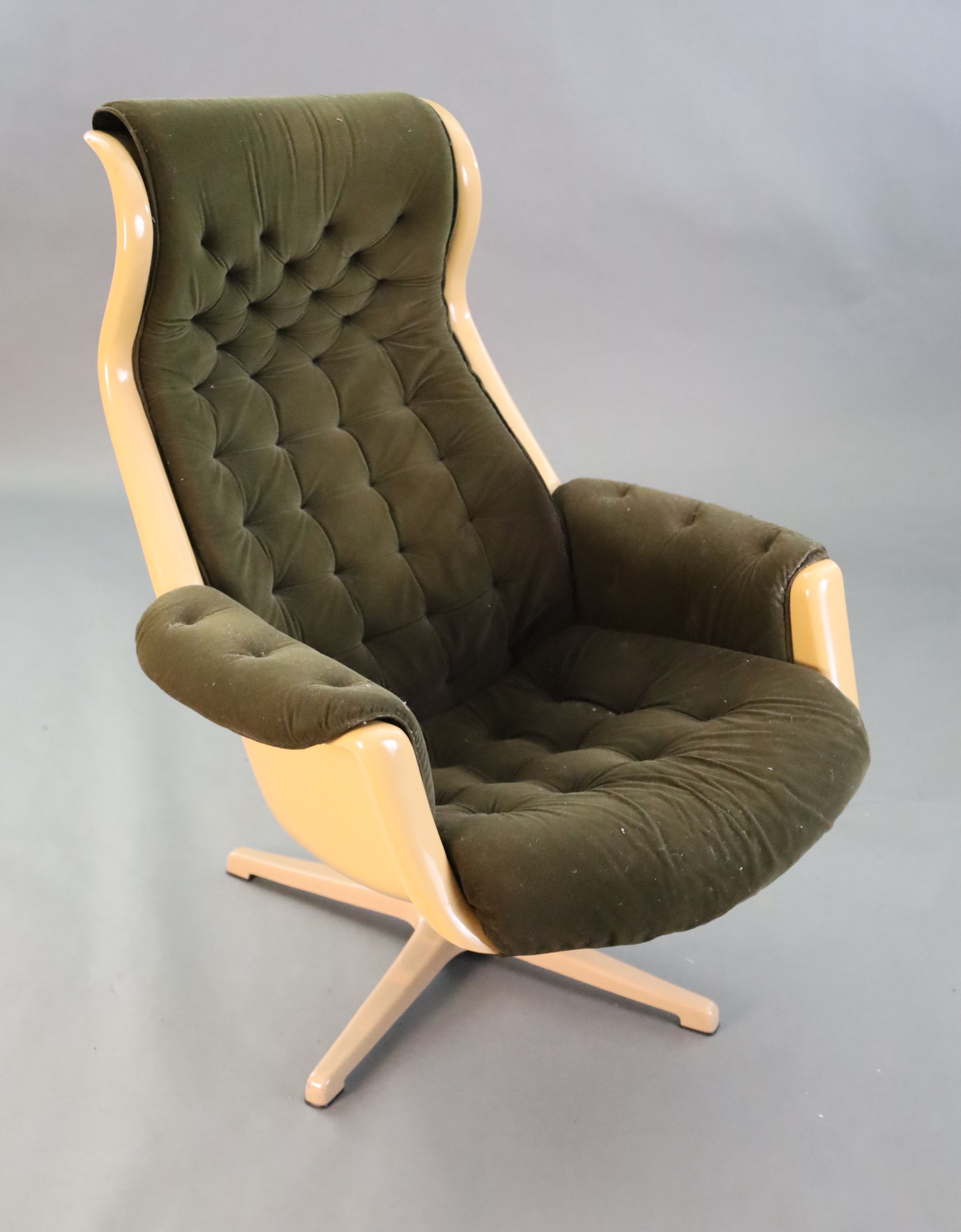 A Svensson and Sandstrom Swedish moulded plastic chair, upholstered in buttoned brown fabric with