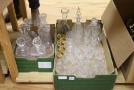 Eight cut glass decanters and mixed drinking glasses