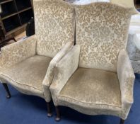 A pair of 1920s upholstered armchairs, width 70cm, depth 70cm, height 102cm