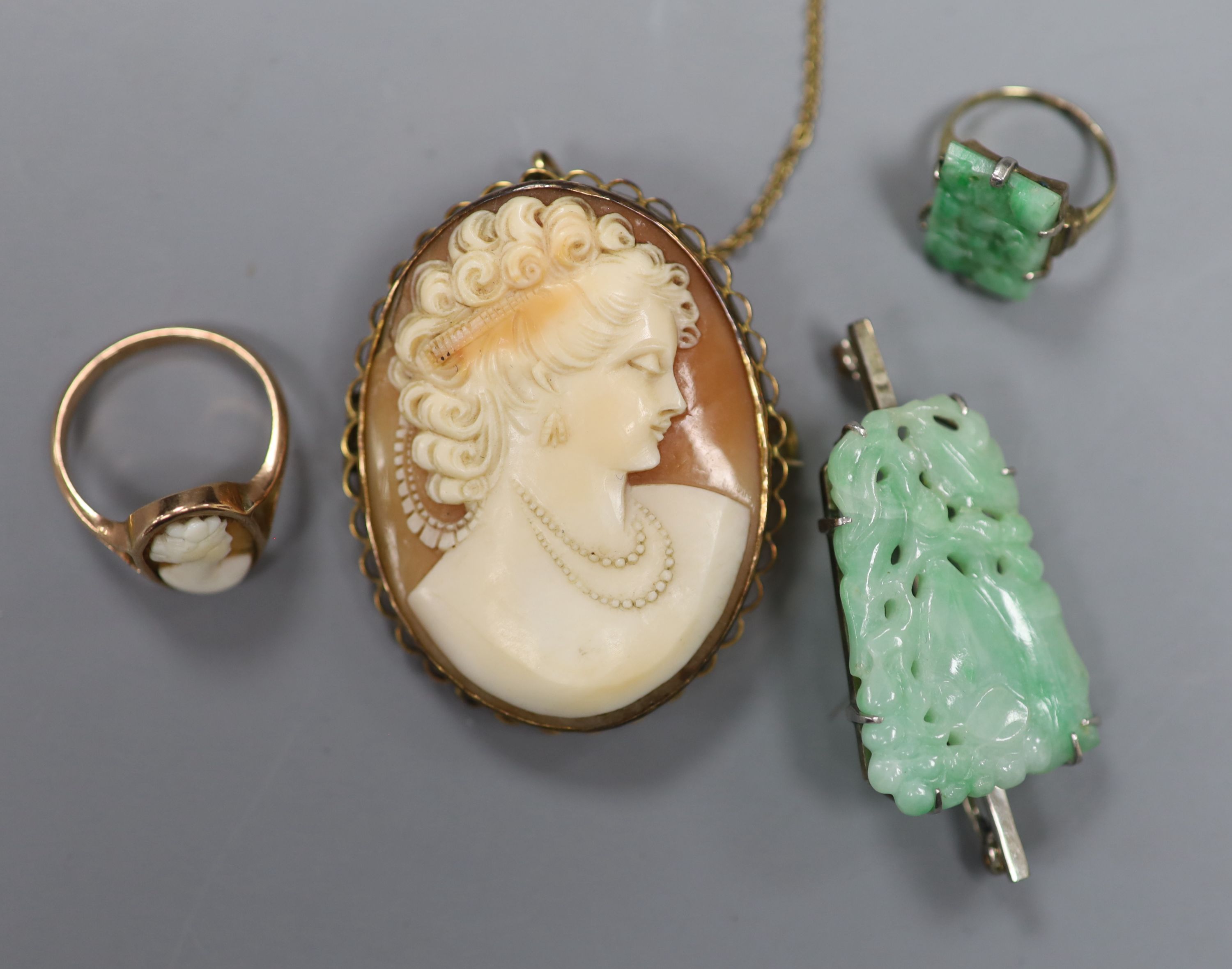 A 9ct mounted oval cameo shell brooch, 47mm, gross12.6 grams, two rings including 9ct cameo and