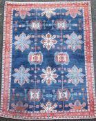 An Iranian Loribaft blue ground rug, with field of floral motifs and three row border, 225 x