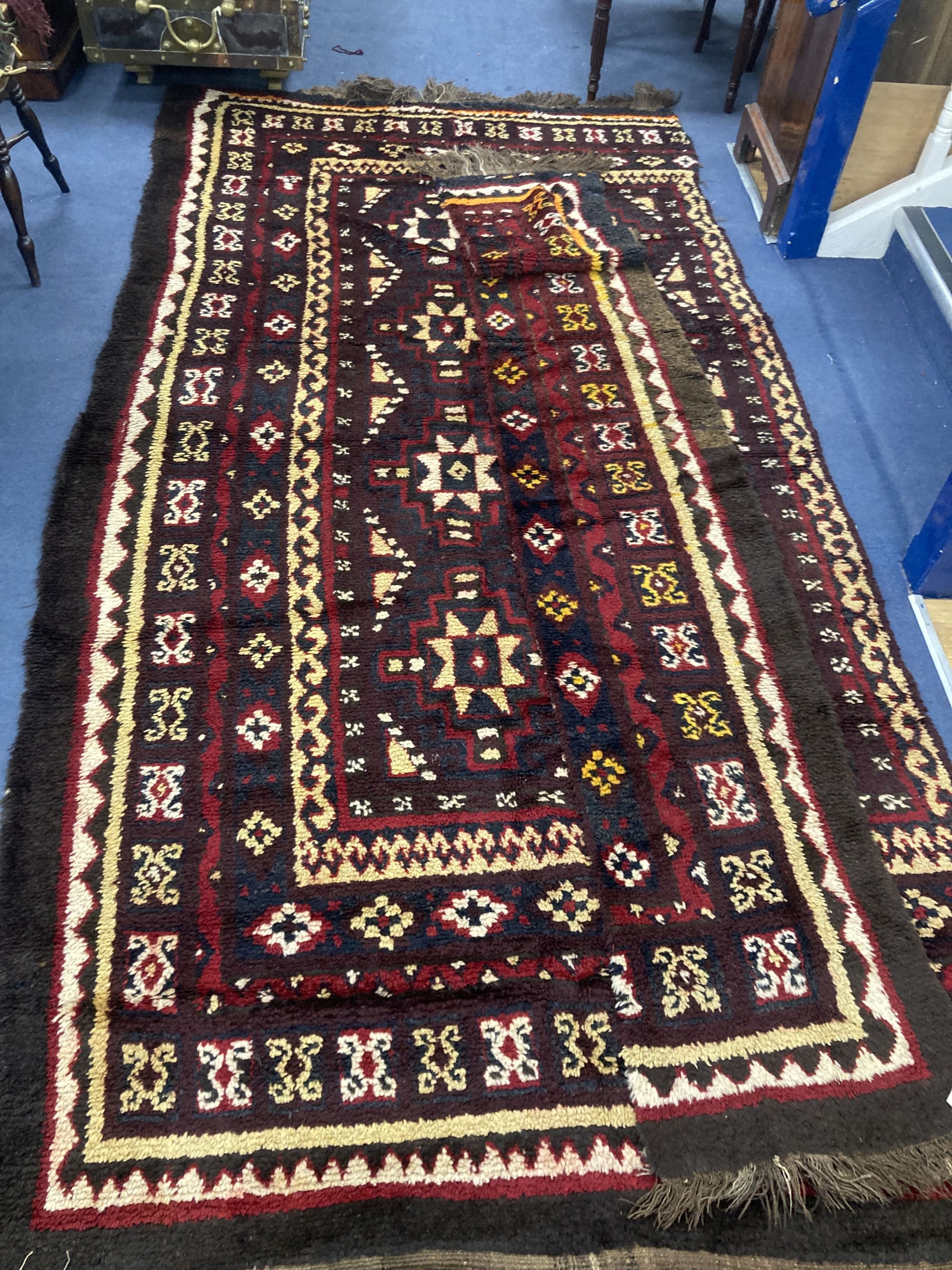 A central Asian wool carpet, 350 x 220cm (in two sections)