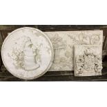 Three reconstituted stone and plaster wall plaques, largest 94 x 40cm