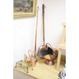 A Victorian copper coal helmet, A Victorian copper kettle, a Victorian copper coaching horn and
