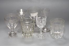 A pair of square base glasses and four others