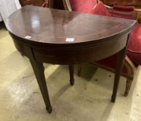 A George III style inlaid mahogany 'D' shaped folding card table, width 92cm, depth 46cm, height