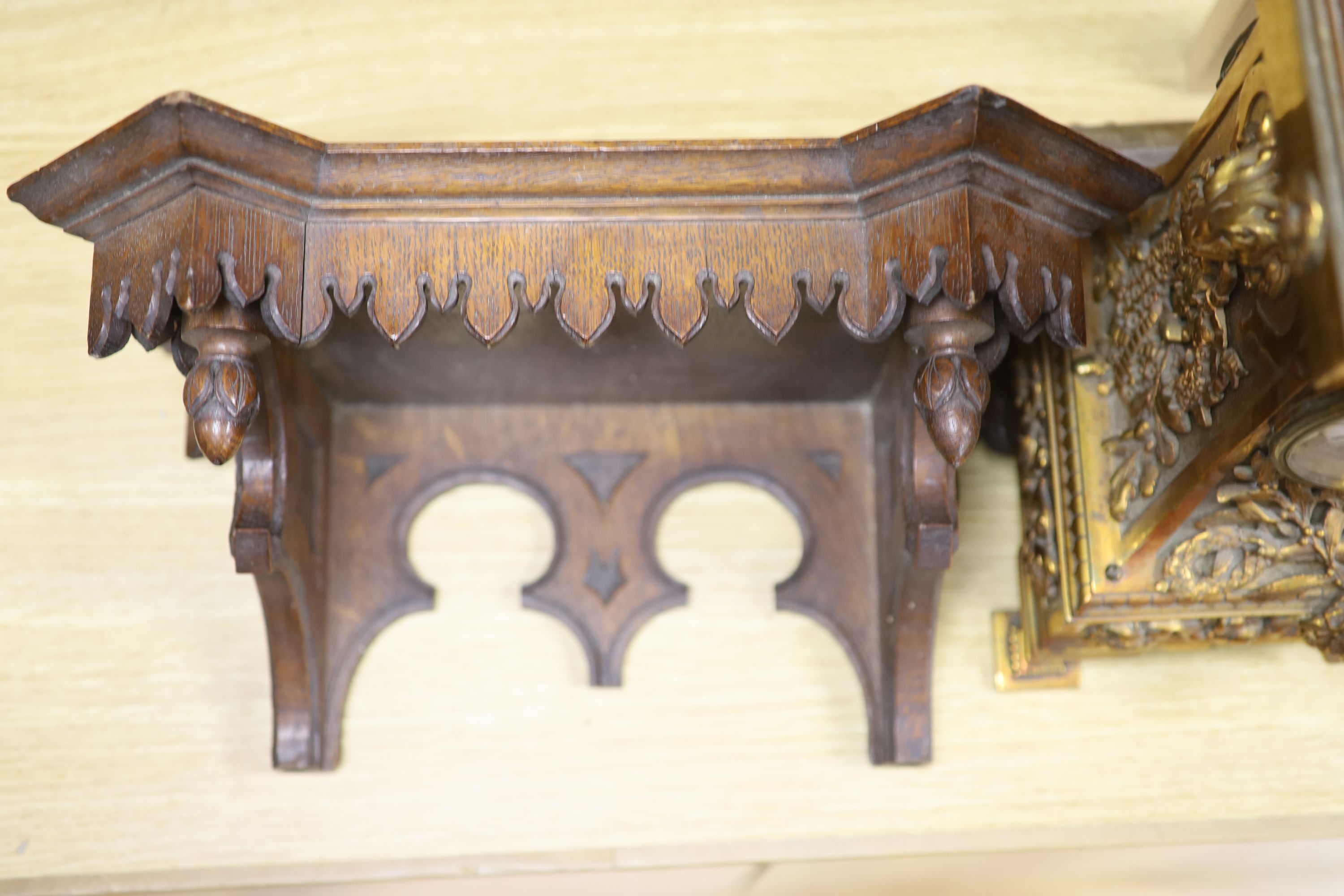 A late 19th century French cast brass cased eight day mantel clock and a carved oak clock bracket, - Image 4 of 5