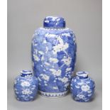 A tall 19th century Chinese blue and white lidded vase and a pair of lidded ginger jars, tallest