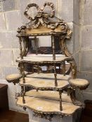 A Victorian gilt carved wood and gesso four tier mirrored bracket, width 70cm, depth 17cm, height