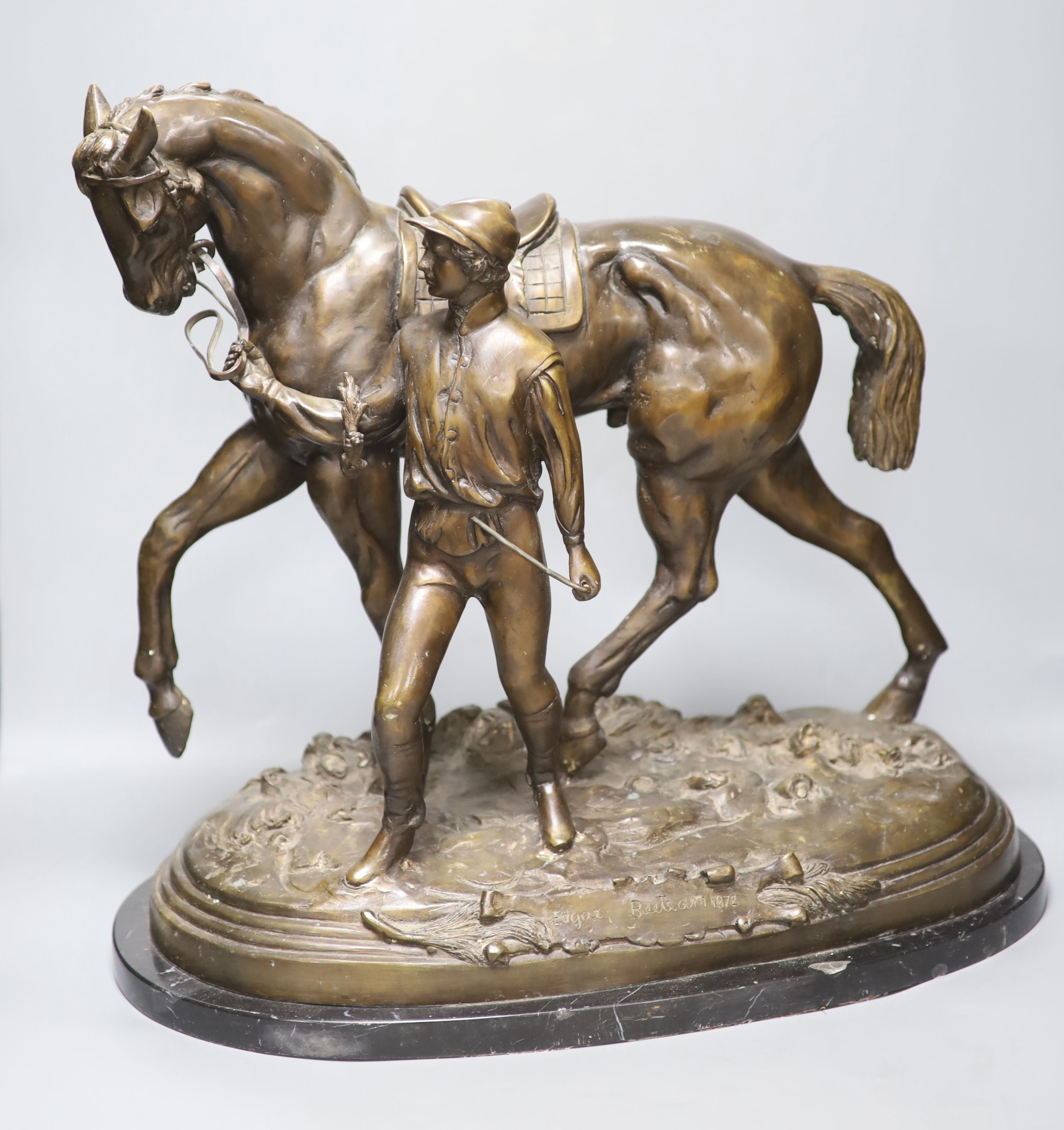 After Edgar Beetram. A large bronze horse and jockey, signed 1872, length 52cm