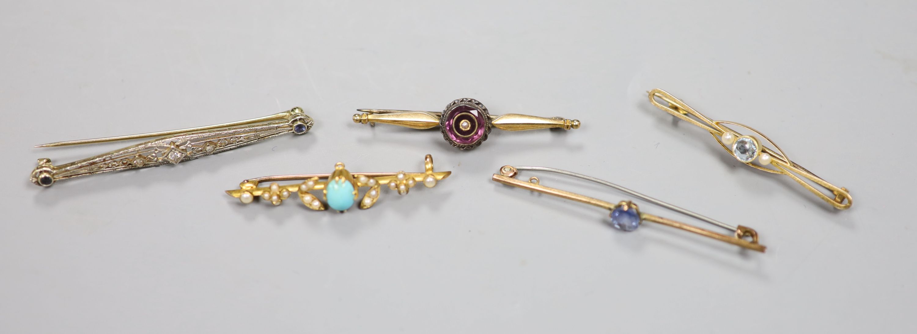 Five assorted bar brooches including early 20th century yellow metal sapphire and diamond set, a