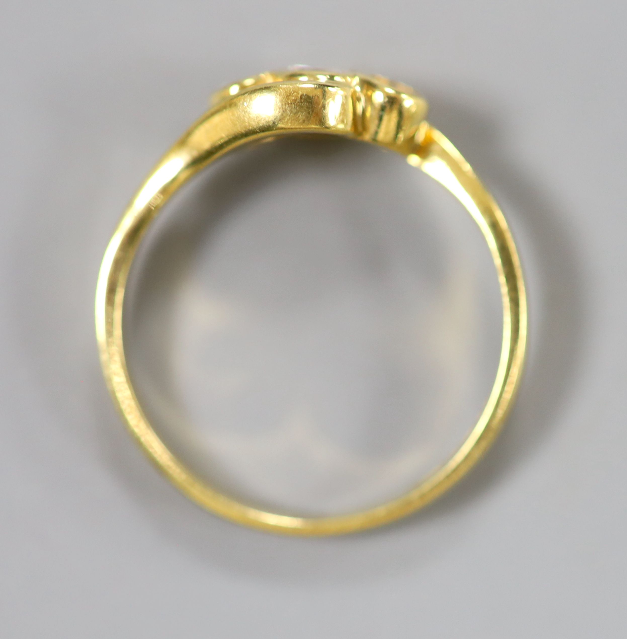 A modern 18ct gold and three stone diamond set crossover ring, size N, gross 3 grams. - Image 3 of 3