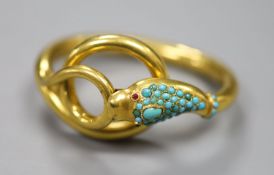 A Victorian pinchbeck and turquoise set hinged serpent bangle, with gem set eyes.CONDITION: Some