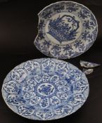 Two Kangxi Chinese blue and white export chargers, one decorated with a basket of flowers, the other