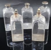 A part set of five early 19th century cut glass decanters, of square form with facetted shoulders,