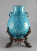 A Chinese turquoise glazed vase, Hu, late Qing dynasty, the neck applied with a pair of elephant