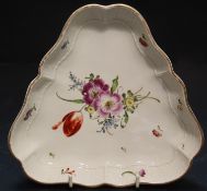 A Ludwigsburg porcelain triangular shaped dish, painted with a floral bouquet, 18cmCONDITION: