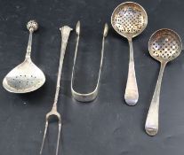 A group of mixed flatware: two George III silver sifter ladles, a Continental spoon(repaired), a