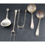 A group of mixed flatware: two George III silver sifter ladles, a Continental spoon(repaired), a