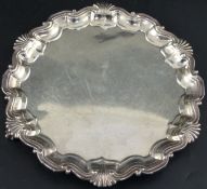 A late Victorian silver salver with shell and scroll border, Goldsmiths & Silversmiths Co Ltd,