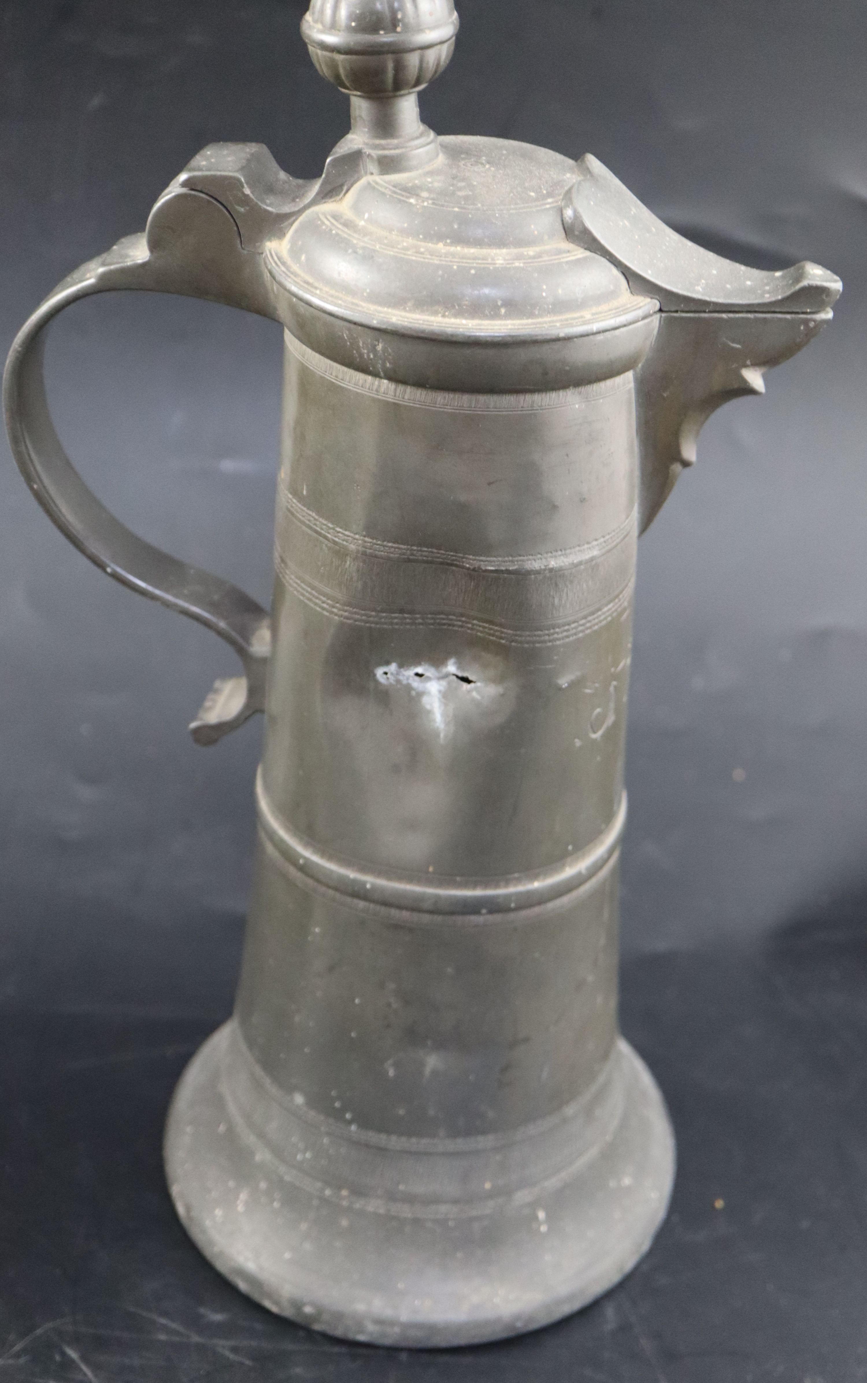 An 18th century Continental pewter flagon, initialled and dated 1777, height 35cm, a later flagon - Image 3 of 17