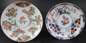 A Chinese Kangxi famille verte saucer dish, decorated with flowers branches and mon motifs, 26.75cm,