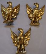 A set of three carved giltwood heraldic eagles, width 24cm height 26cmCONDITION: Look to date from