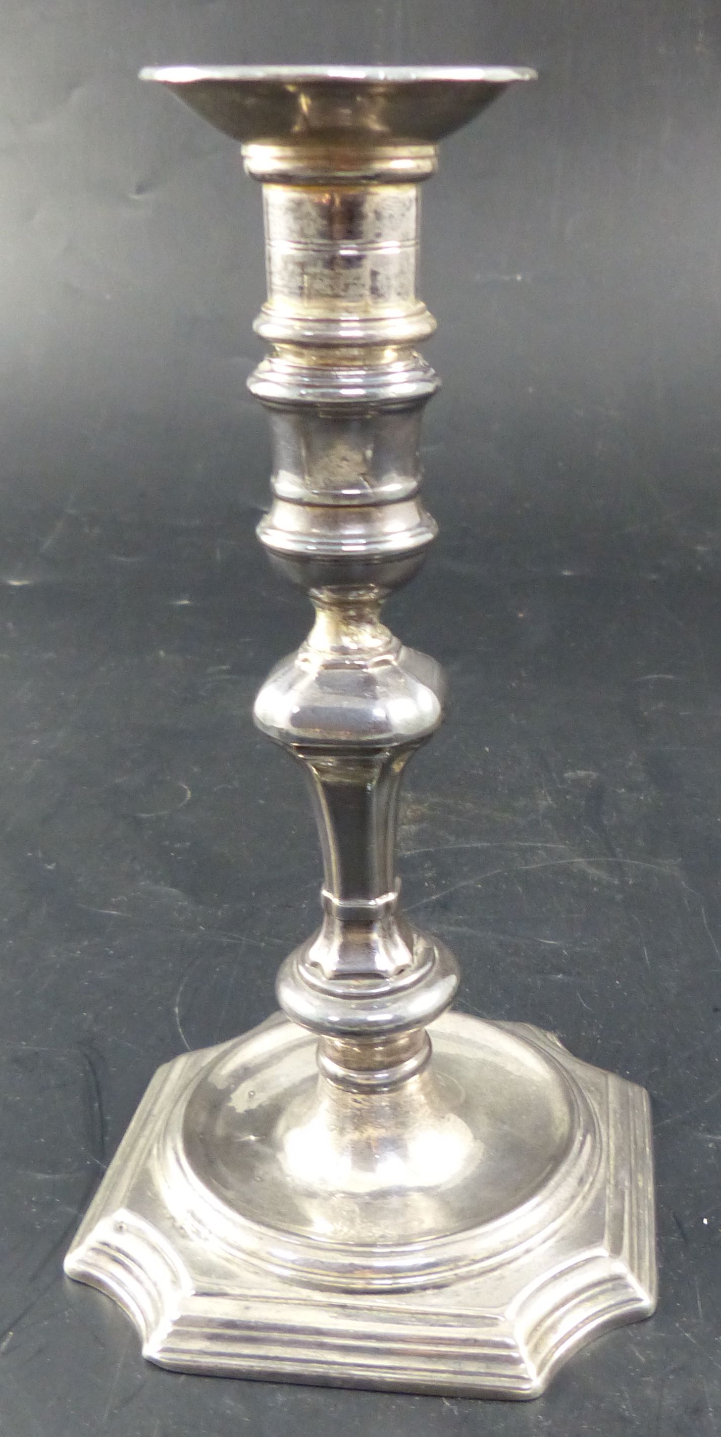 A George II cast silver candlestick, by Abraham Buteux, London, c.1725, 14.7cm, 11oz, with later
