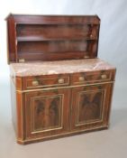 An early 19th century Northern European mahogany cabinet de toilette, inlaid with brass, the