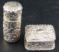 A silver rectangular patch box, with crimped border, chased with 'C' scrolls and flowers, height