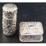 A silver rectangular patch box, with crimped border, chased with 'C' scrolls and flowers, height