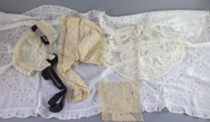 A fine white worked embroidered lace inset coverlet, a filet lace square of a figure wearing a crown