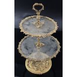 A Victorian ormolu and glass two tier cake stand, cast with vineous bands and rococo scrolls, height