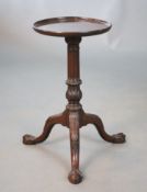 A George II mahogany wine table, with later dishes circular top, fluted and acanthus carved stem