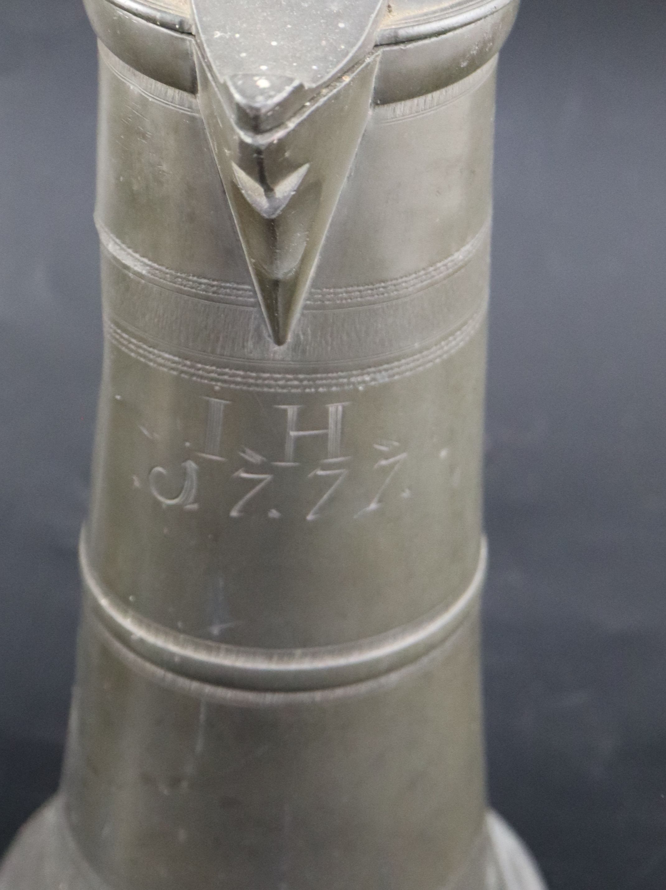 An 18th century Continental pewter flagon, initialled and dated 1777, height 35cm, a later flagon - Image 2 of 17