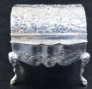 A Hanau embossed silver trinket box, formed as a miniature bureau, on mask and hoof feet, import