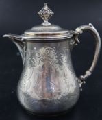 A Victorian small engraved silver hot water pot, with engraved crest, George Ivory, London, 1845,