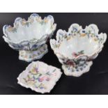 Two Nove faience monteiths, late 19th century, of silver shape, each well painted with flowers and